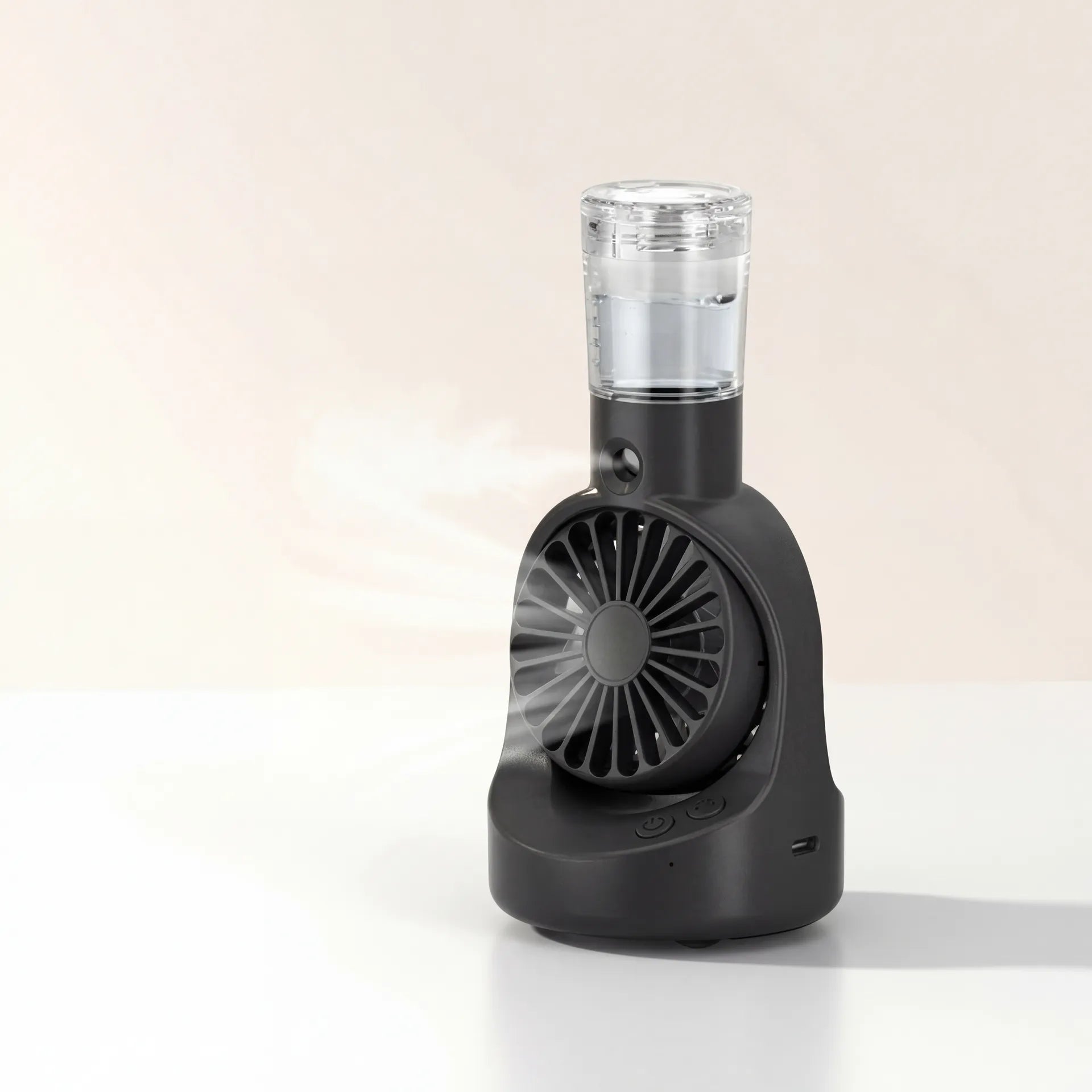 Portable spray cooling fan on clean light studio background